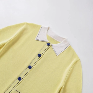 Chic lemon yellow knit polo cardigan with white contrast collar and black stitching