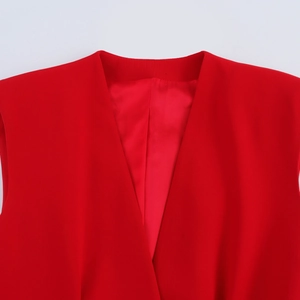 Detail of V-neck tailoring and sewing craftsmanship on the red sleeveless vest top