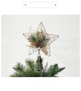 Macro detail of Christmas tree topper star with natural twine, pine cones, and burlap bow