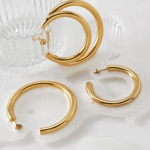Polished gold stainless steel C-shaped chunky hoop earrings with mirror finish