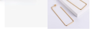 Detail of vacuum plated golden rectangular earrings with high-gloss mirror finish metal