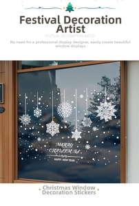 Detail view of white snowflake window clings with Merry Christmas text on glass door