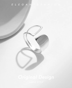 Macro detail of asymmetric S925 sterling silver open ring with irregular hollow surface