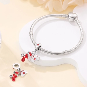 Detailed view of silver stethoscope and nurse hat charms on a snake chain bracelet