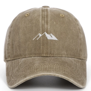 Close-up of mountain peak embroidery on washed cotton vintage style baseball cap