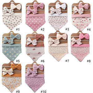Set of 10 cotton muslin baby bibs and matching bow headbands with floral prints