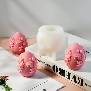 Detailed macro view of 3D rose flower embossed egg-shaped silicone mold and finished crafts