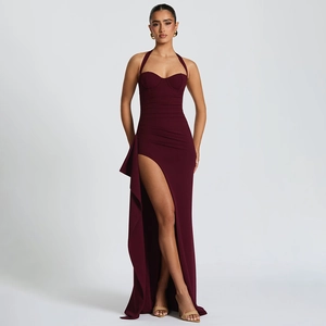 Deep red halter neck maxi dress featuring a high side slit and backless silhouette