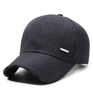 Winter men's baseball cap with ear flaps and metal sport tag in dark grey textured fabric