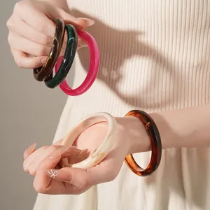 Elegant tortoiseshell resin bangle set with marble texture and round polished finish