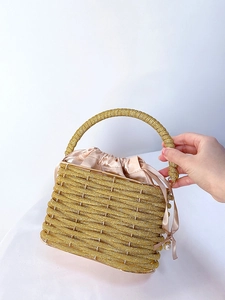 Elegant gold beaded bucket evening bag with satin lining and pearl ribbon handle