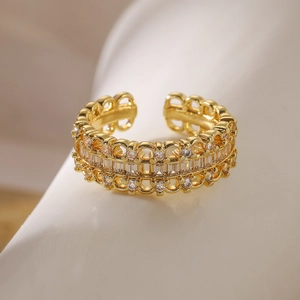 Close-up of gold geometric open ring featuring hollow design and sparkling zircon stones