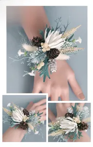 Close-up of a forest-style wrist corsage with pine cones and white flowers for weddings