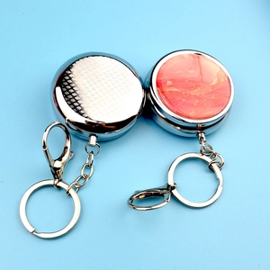 Portable metal mini pill box with key ring in silver cross and pink marble patterns