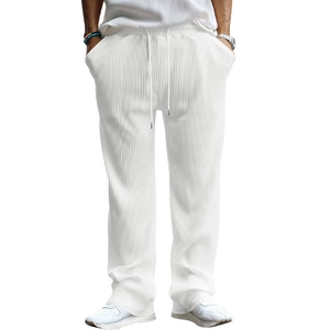 Detail of white men's ribbed casual pants showing texture side pockets and drawstring waist