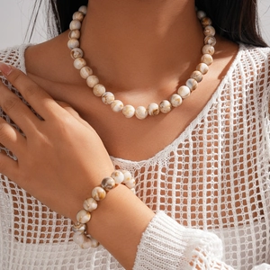 Boho style acrylic beaded necklace and bracelet set with marble brown textures