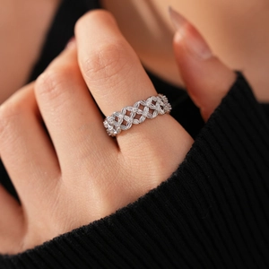 Detailed view of 18k gold plated hollow flower ring with cubic zirconia stones