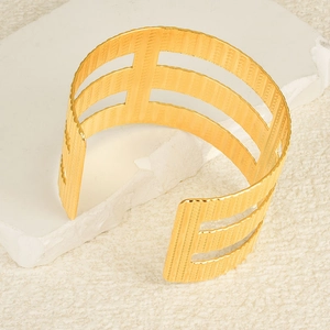 Adjustable 18K gold-plated stainless steel open bangle with hollow vertical stripe design