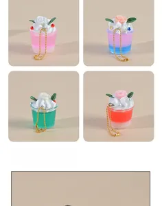 Detailed view of colorful miniature dessert keychains with cream and rose accents