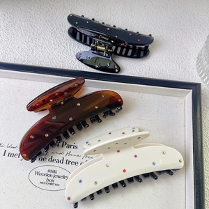 Chic acetate hair claws with colorful rhinestones in black, brown and cream colors