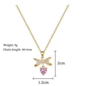 Detail view of bow heart necklace with dimensions showing 3g weight and 40+5cm chain length