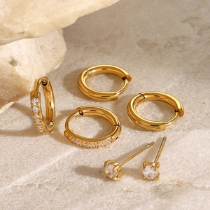 Three-piece gold stainless steel earring set with zircon hoops and studs on stone