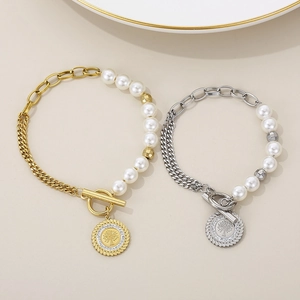 Detail of tree of life charm bracelets with pearls and crystals in gold and silver finish