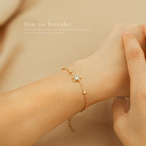 Elegant gold plated stainless steel star bracelet with zircon flower charm for women
