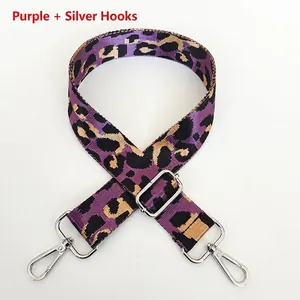 Detail of adjustable purple leopard nylon strap with rotatable silver metal hooks