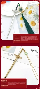 Detail of silver and gold sword hairpins with tassels and green floral accents