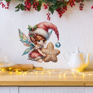 Detail of Christmas fairy wall sticker with wings and star gingerbread on white wall
