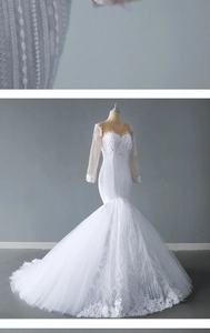 Detailed view of white mermaid wedding dress with lace embroidery and sequined bodice
