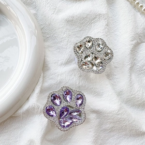 Detailed close-up of luxury rhinestones cat paw phone socket with sparkling crystals