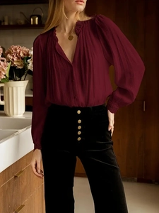 Elegant wine red pleated long sleeve blouse with lace cuffs and black high waist trousers