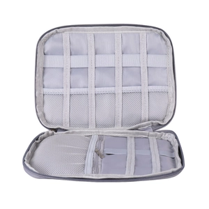 Gray storage organizer showing inner elastic loops and mesh pocket for watch bands