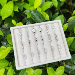 Detailed close-up of S925 sterling silver earrings with heart and geometric zircon charms