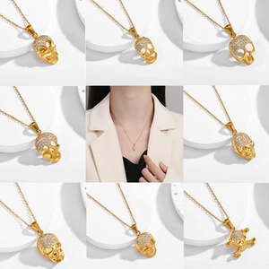 Collier pendentif crâne hip-hop plaqué or avec strass blancs pour hommes et femmes