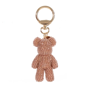 Detail of rose gold rhinestone-encrusted bear keychain with a sturdy gold metal ring