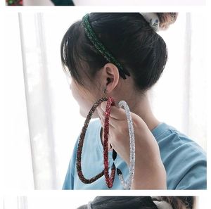 Close-up of glitter hair hoops in green, red and silver for Christmas celebrations