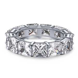 Macro detail of high-quality eternity ring featuring radiant square-cut stones in silver band