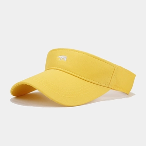 Side view of a bright yellow sun visor hat with white polar bear embroidery detail