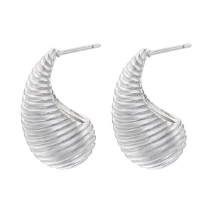 Detailed view of silver croissant dome earrings with horizontal ribbed texture