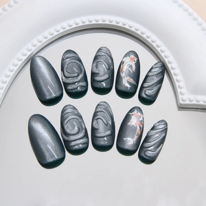 Deep gray cat eye press-on nails with 3D water ripples and koi fish art patterns