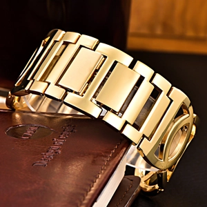 Elegant gold stainless steel link bracelet watch displayed on dark leather texture