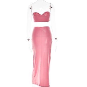 Detail of pink crop top and high slit maxi skirt set on a transparent mannequin