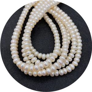 Natural high-luster freshwater pearl strands for DIY jewelry making on dark background