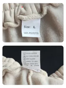 Detailed view of the garment waist with size L label and 100% polyester composition tag