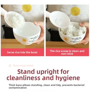 Vertical rice scoop with non-stick bump surface and cute smiley face cutout detail