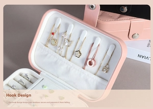 Pink PU leather jewelry box detail with necklace hooks and velvet ring slots