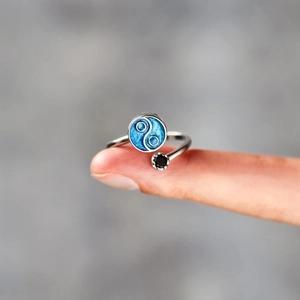 Detailed close-up of s925 silver ring featuring blue Tai Chi enamel and black gemstone